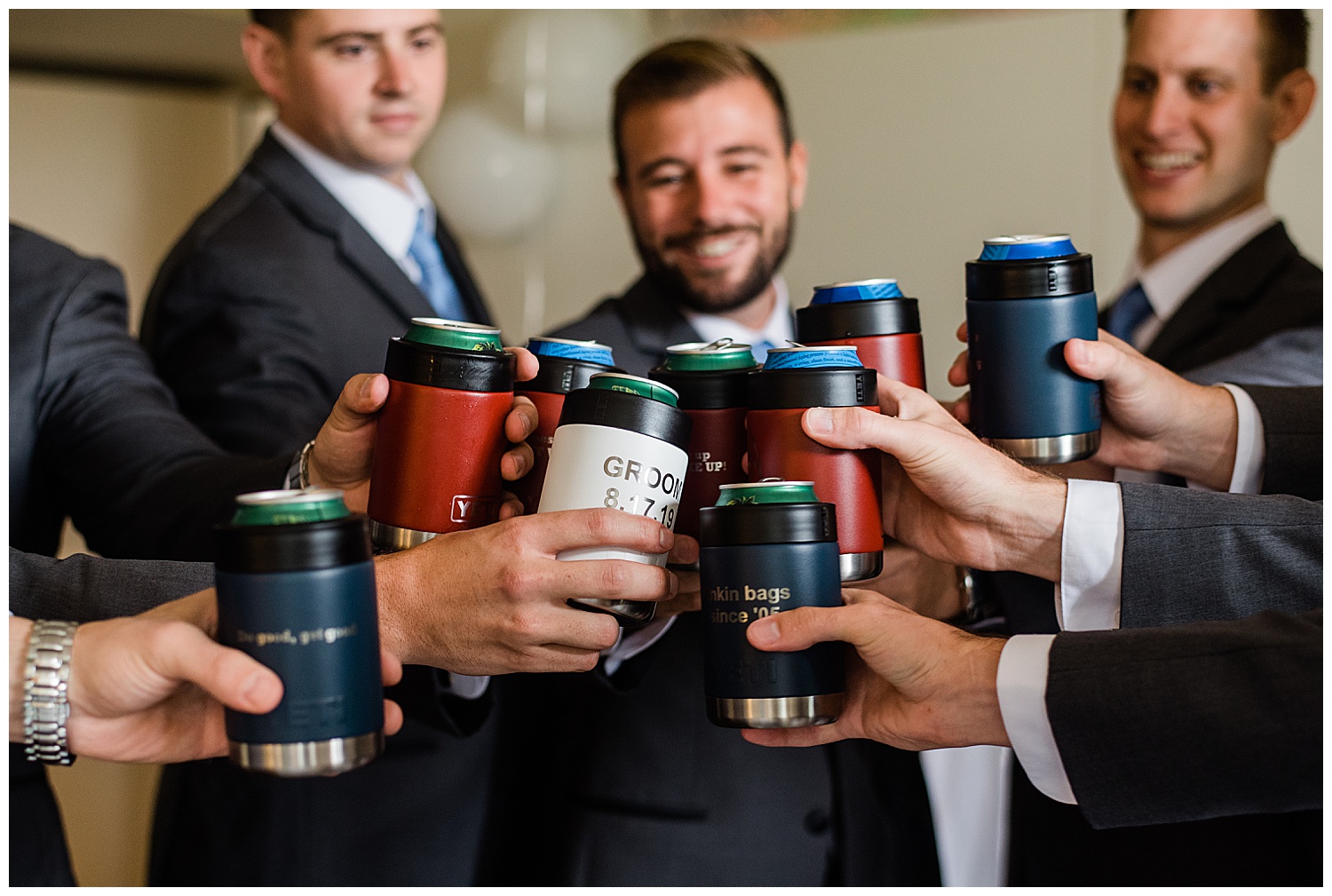 groomsmen cheers beer with personalized cozies