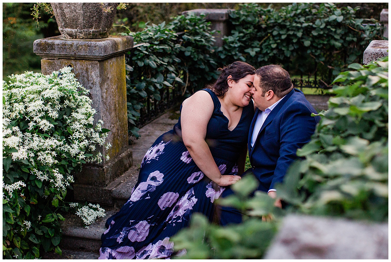 Couple snuggle in overgrown stone patio