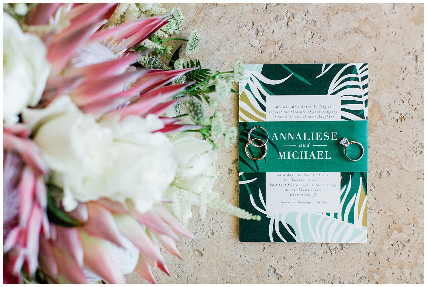 green wedding invitation with tropical bouquet