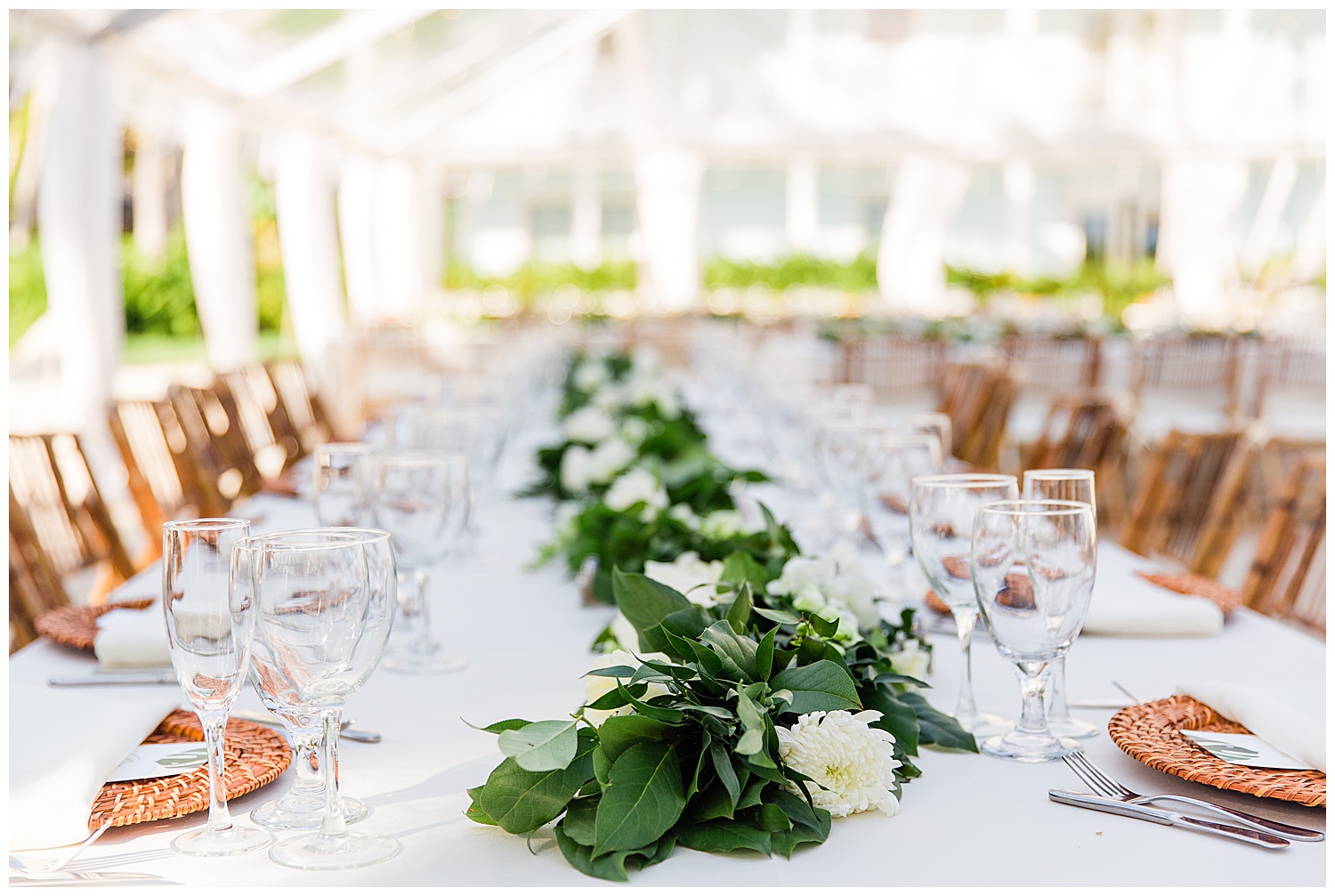 greenery swag lines reception tables with white linens